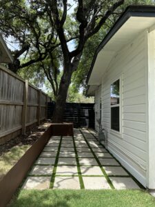 Lawn with pavers on white house